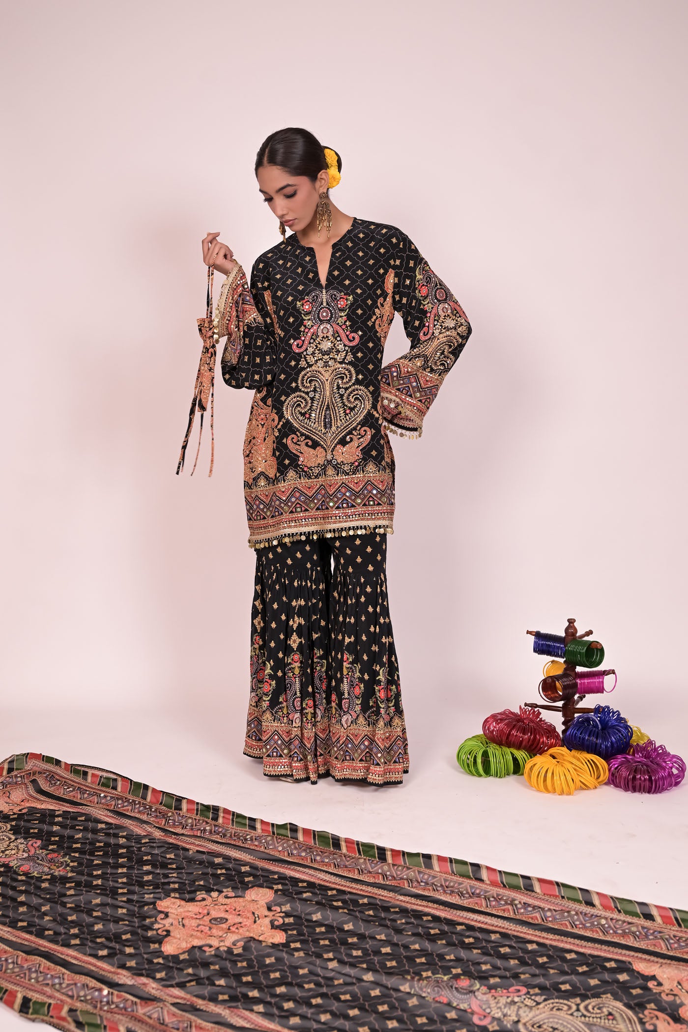 Short black kurti with sharara and printed dupatta